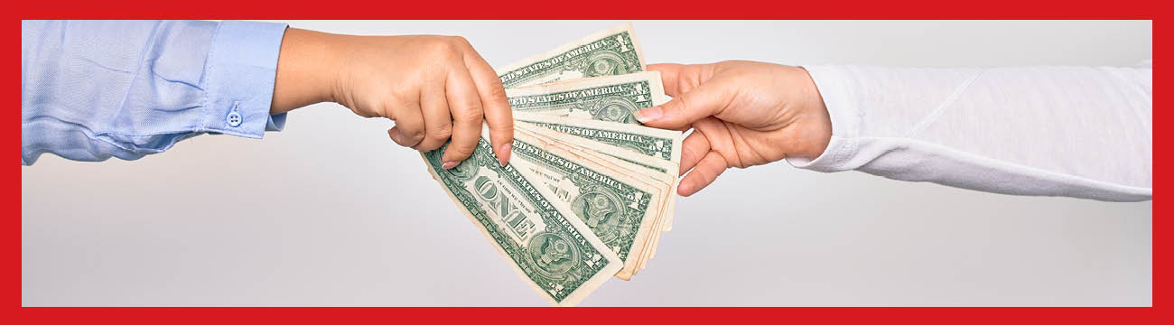 An arm reaching out to hand someone money. A second arm reaching out to accept it. 