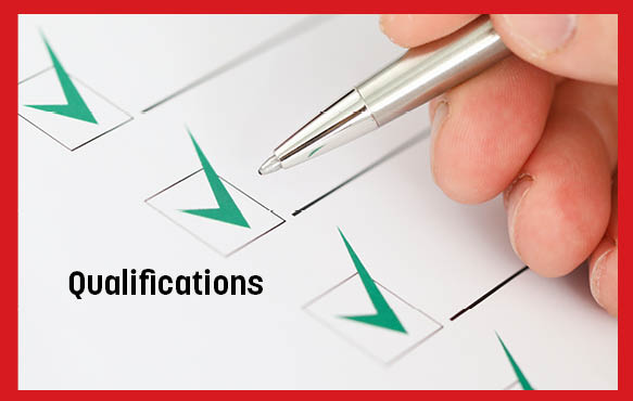 A hand holding a pen above a sheet of paper that has checkmarks in boxes. The image has the word "Qualifications" on it. 